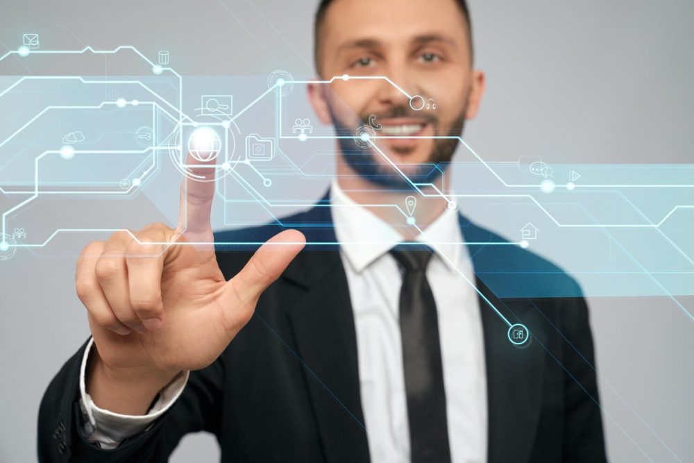 young-businessman-clicking-virtual-button_651396-897-1000×667